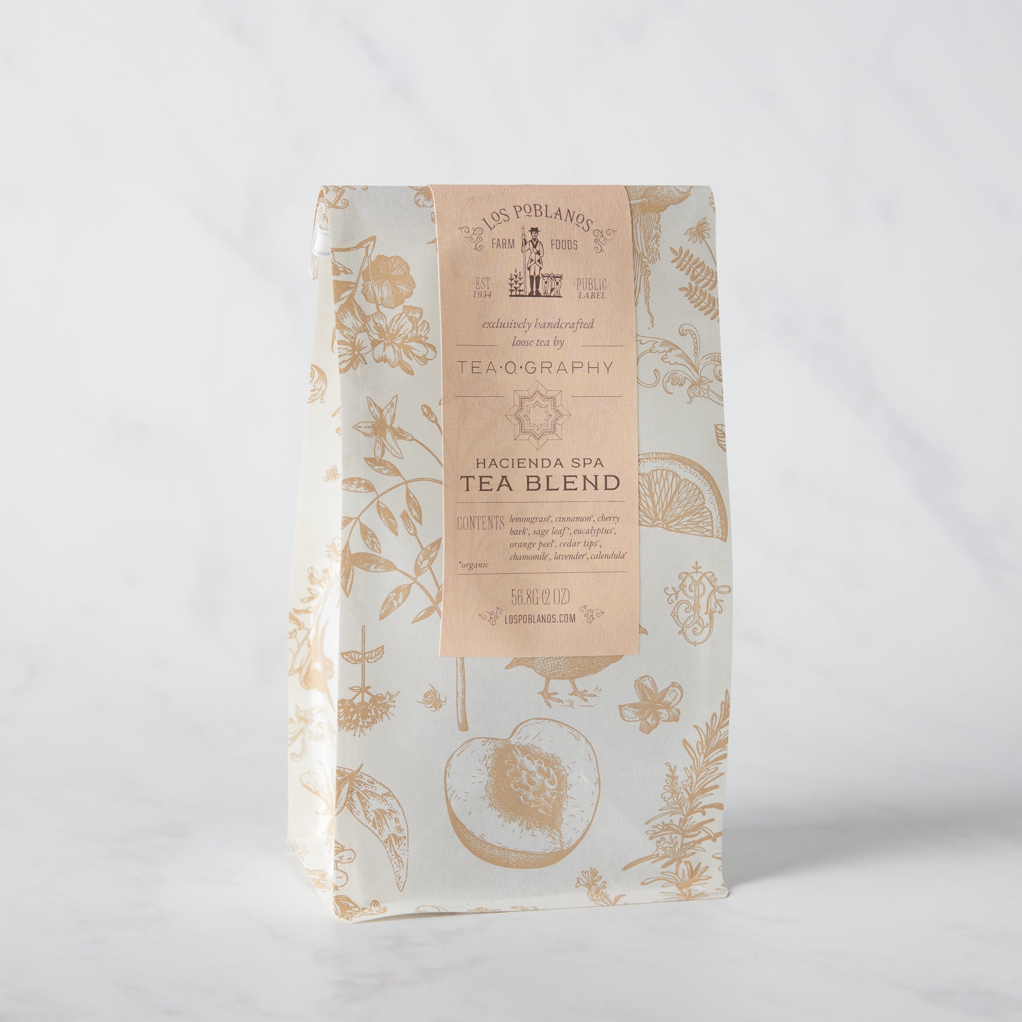 Packaged tea blend with botanical design, labeled 'Hacienda Spa Tea Blend'.