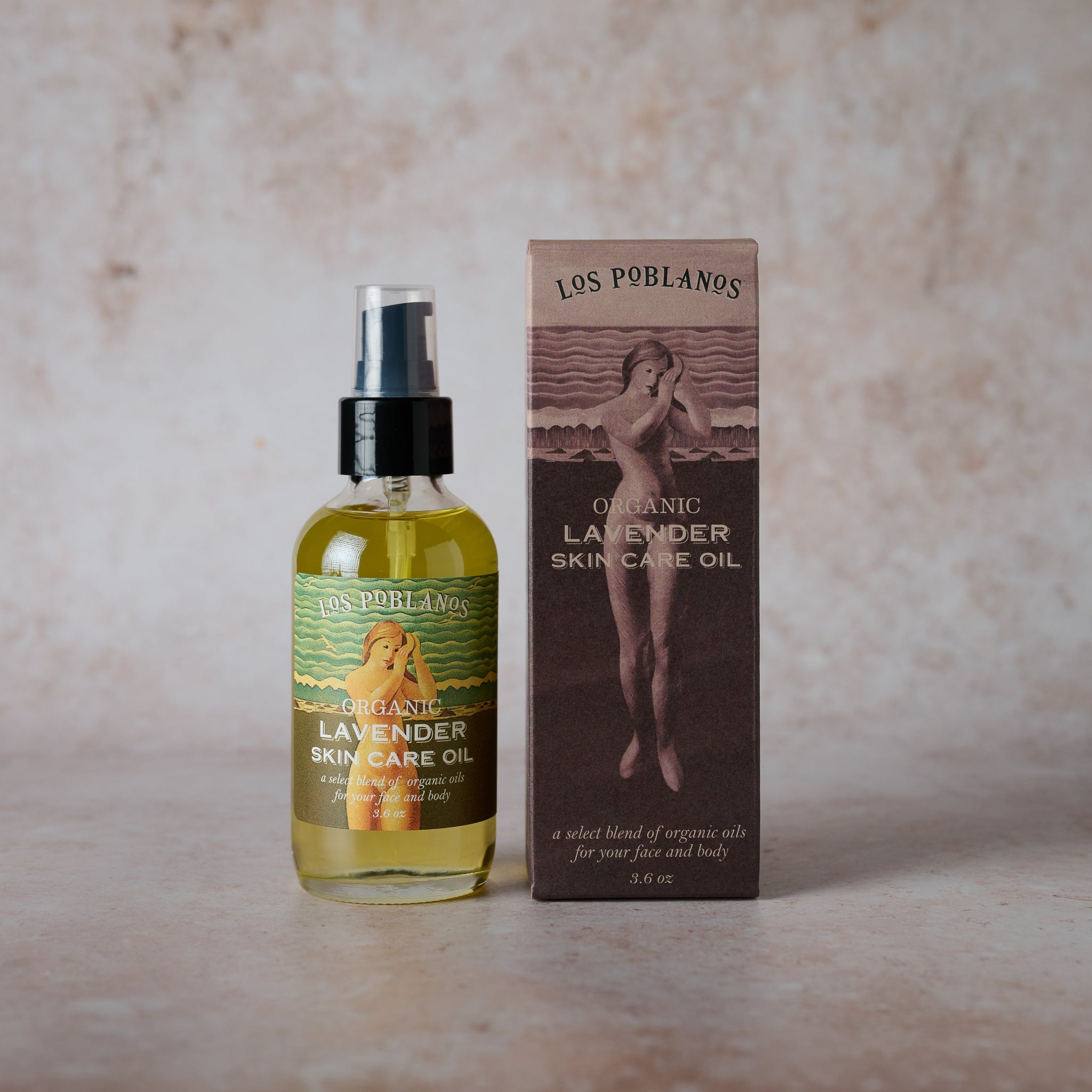 A bottle of Organic Lavender Skin Care Oil next to its packaging box, with the Los Poblanos branding visible.