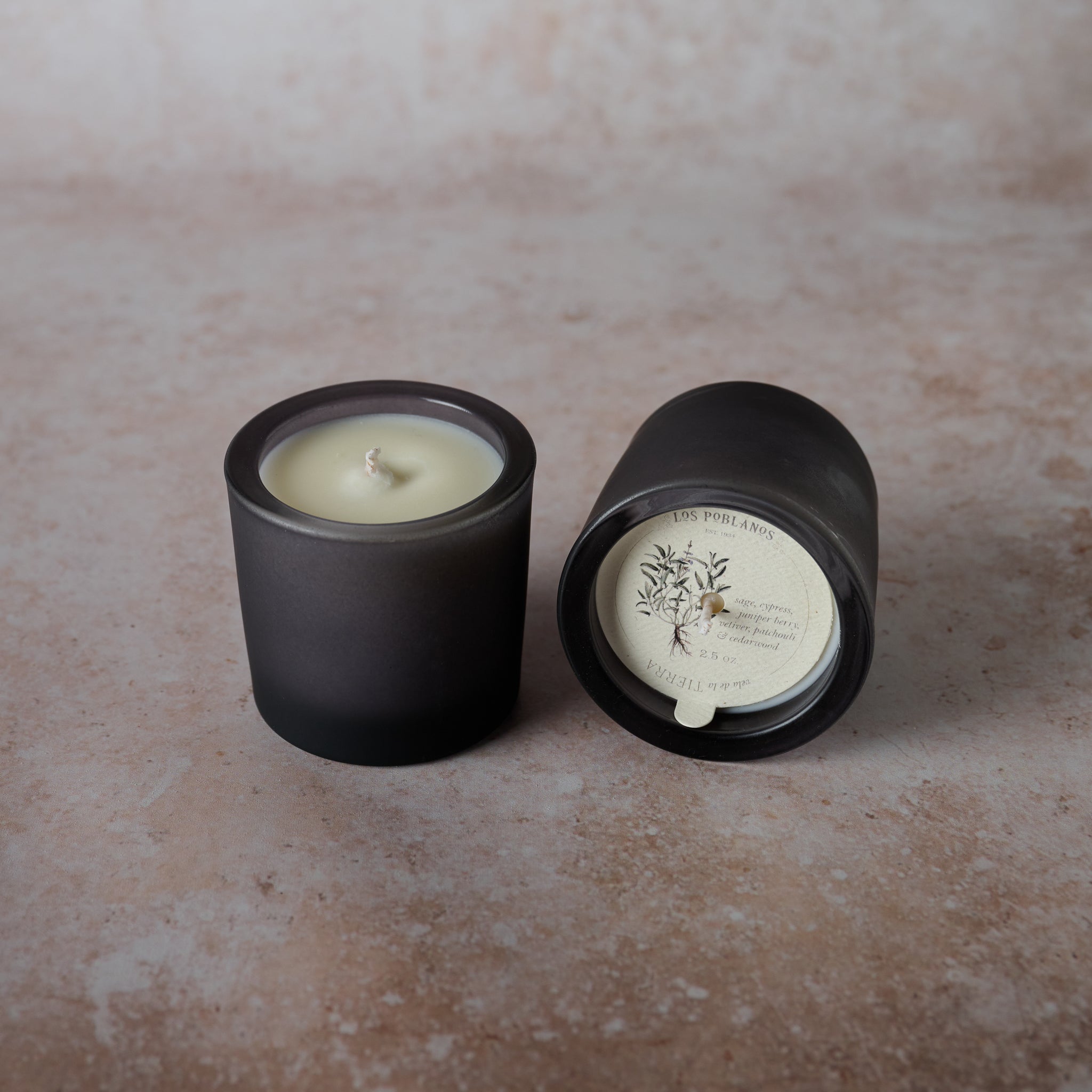 A black soy wax candle, Infused with sage and vetiver essential oils.