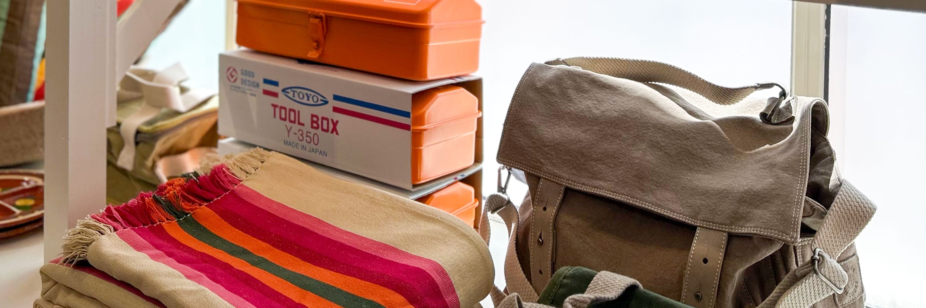 lifestyle products on sandstone backdrop