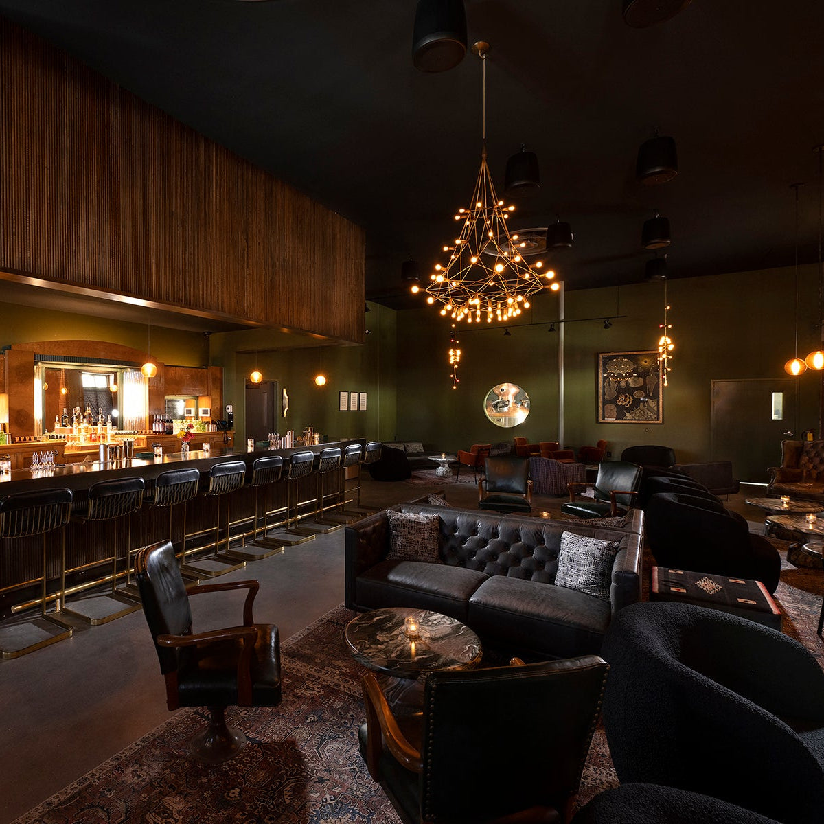 Dark and moody interior of a bar with dim lighting and vintage decor.