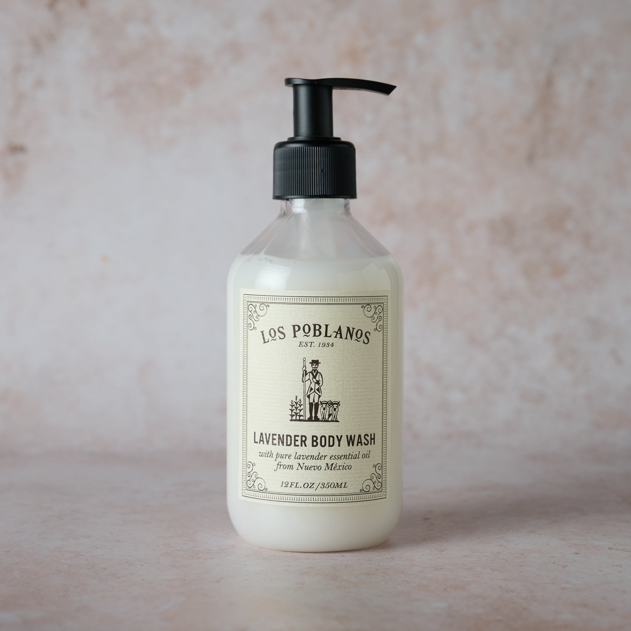 A pump bottle of Los Poblanos Lavender Body Wash with a white label featuring the brand's logo.