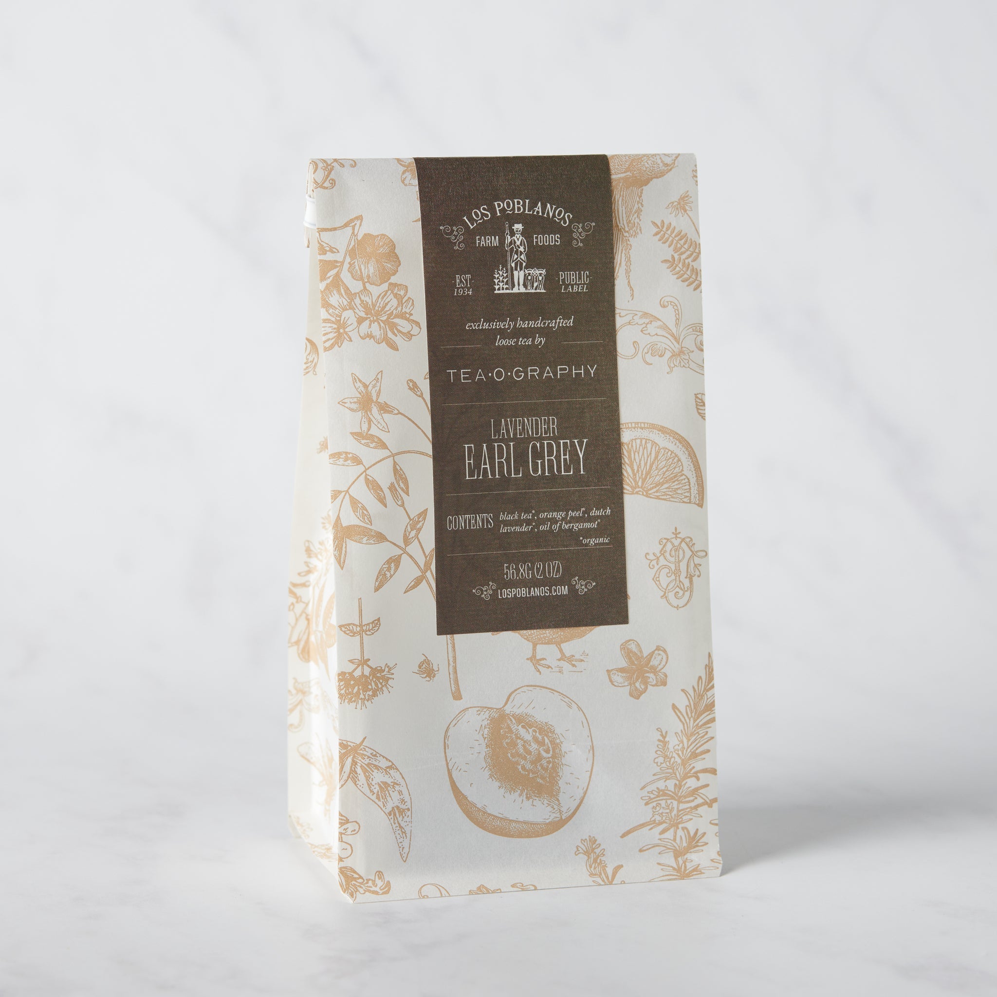 Decorative packaging of Lavender Earl Grey black tea blend with bergamot and lavender, standing against a neutral background