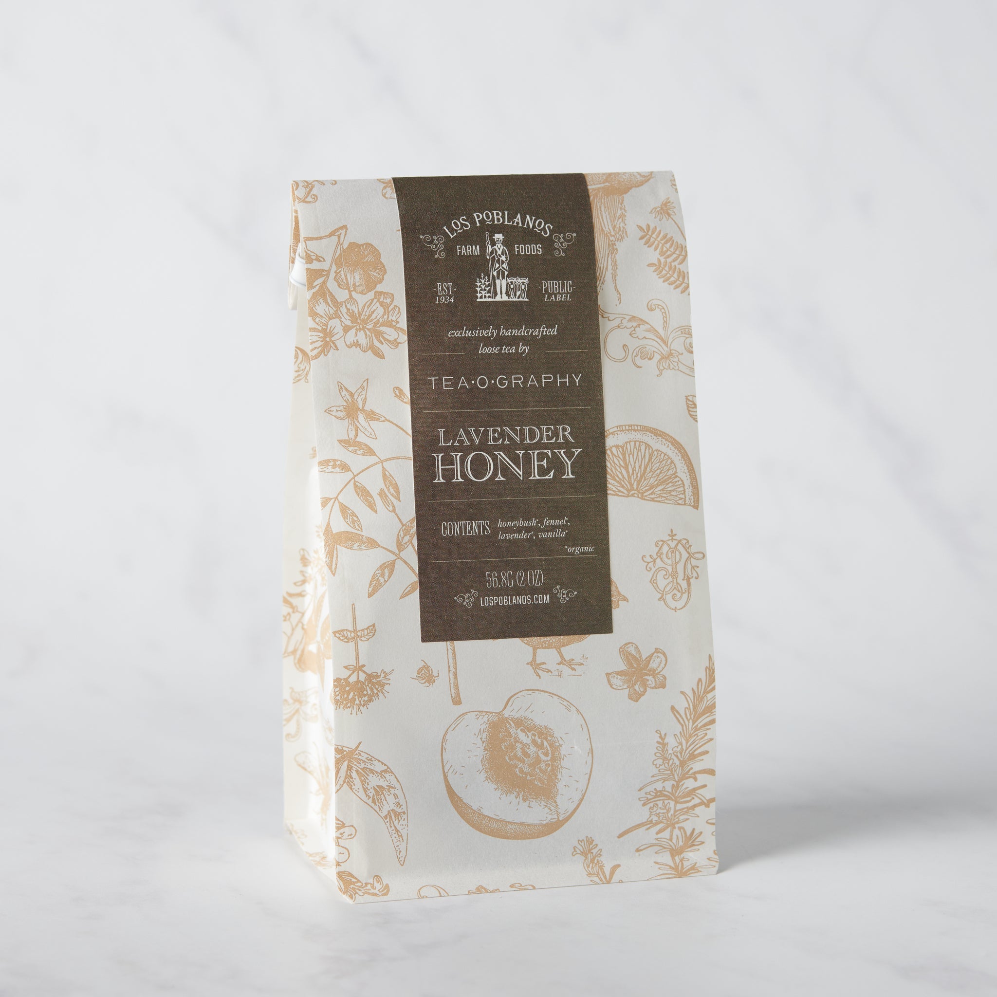 Organic herbal tea pouch reading ‘Lavender Honey Tea — honeybush, fennel, Dutch lavender, vanilla bean’ with minimalist design on a white background