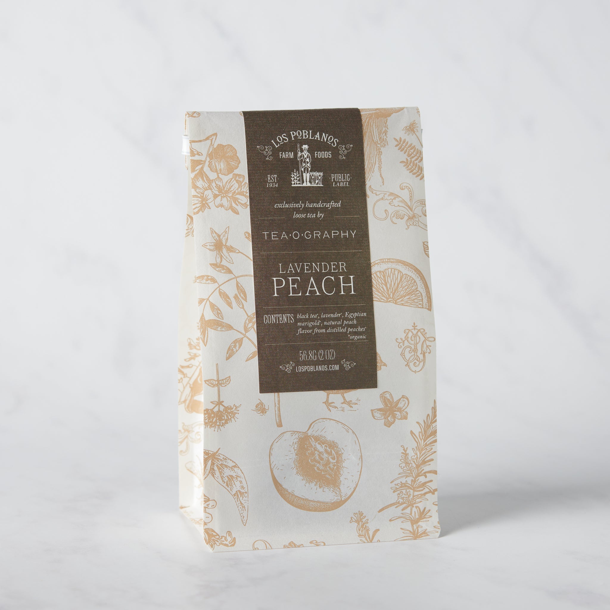 Organic Lavender Peach Tea packaging — white matte pouch with elegant gold line drawing of lavender sprigs, reading ‘Lavender Peach Tea’ on front