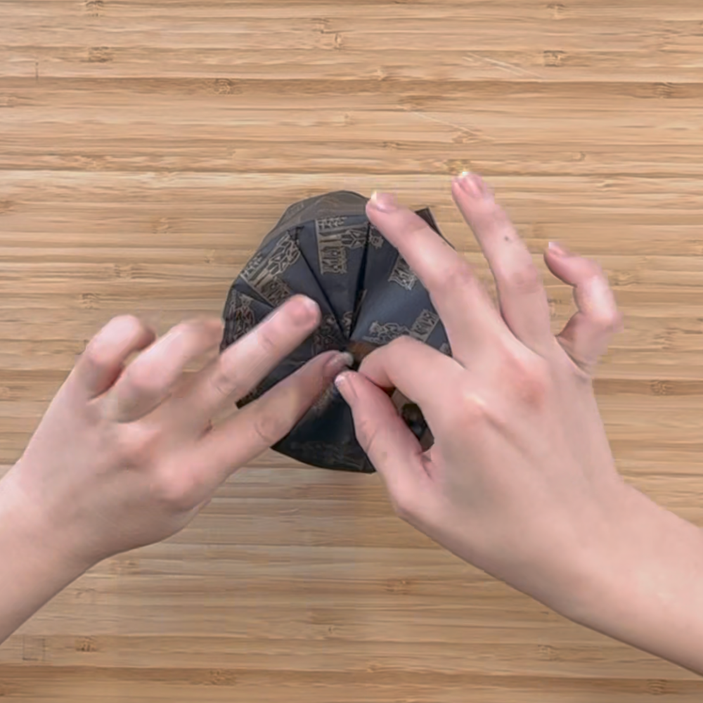 Hand wrapping and boxing a candle.