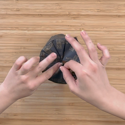 Hand wrapping and boxing a candle.