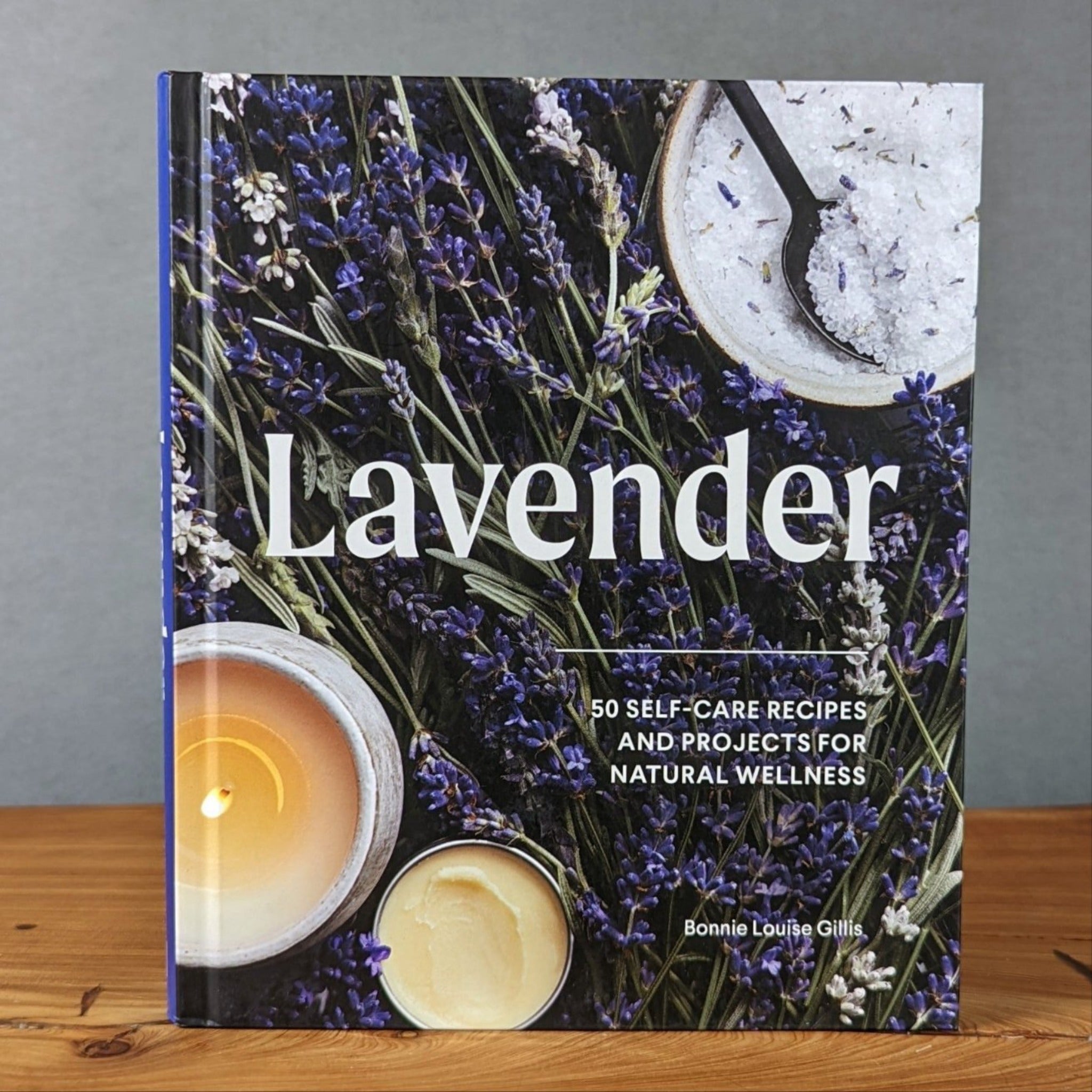 Lavender-themed self-care book with subtitle ‘50 Self-Care Recipes and Projects for Natural Wellness’, cover includes dried lavender bundles and spa-style bowls